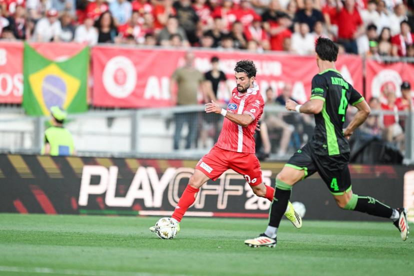 Patrick Cutrone and Monza players celebrate their Serie A return despite a tense play-off finale against Catanzaro. (Tiziano Ballabio / NurPhoto/AFP)