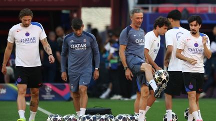 Luis Enrique surrounded by PSG players ahead of the Champions League final at Puskas Arena, Budapest, May 30, 2026