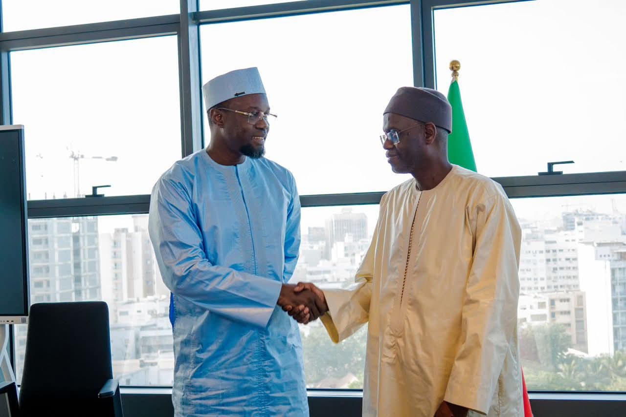 Outgoing Prime Minister Ousmane Sonko and successor Ahmadou Al Aminou Lo
