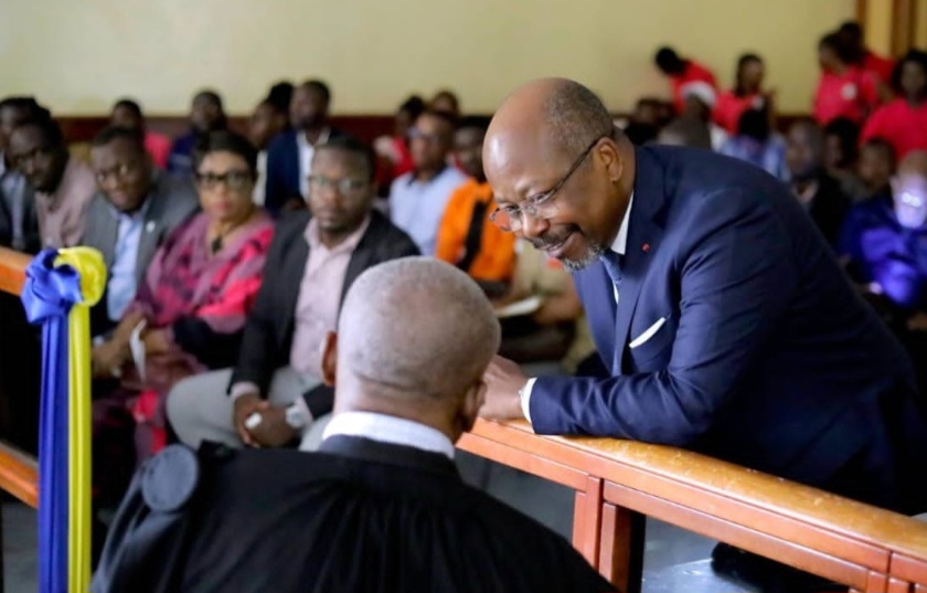 Alain-Claude Bilie By Nze with his lawyer during a hearing