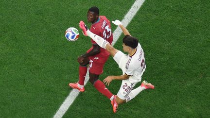 The Portuguese defender Nuno Mendes challenges an Spanish player during the intense World Cup round of 16 match on July 6, 2026 in Dallas, USA.