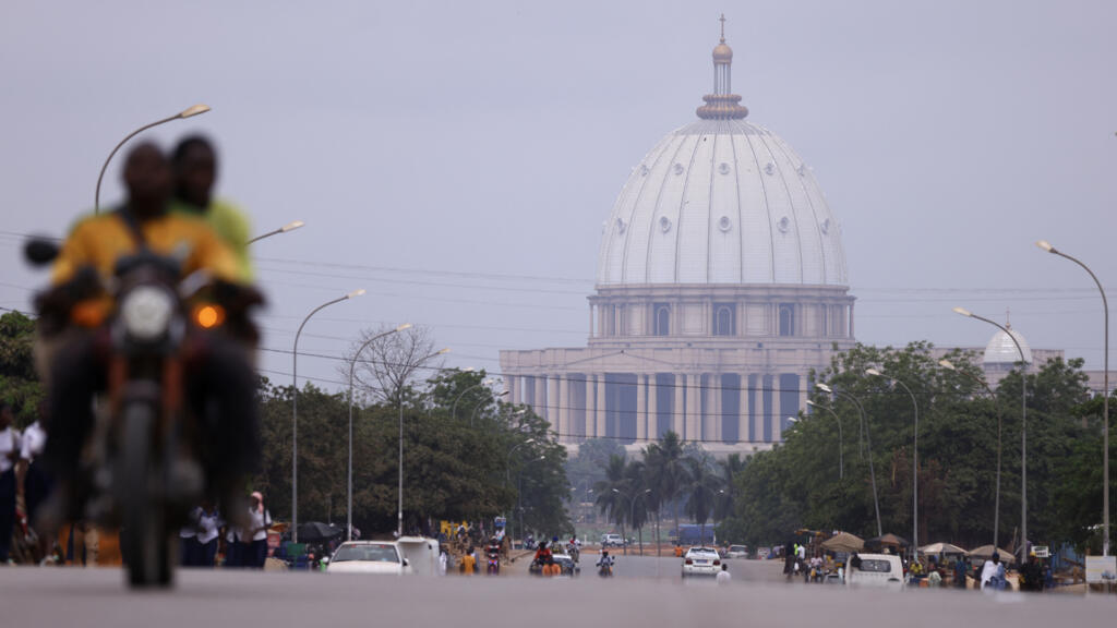 Aerial view of Yamoussoukro's Notre Dame de la Paix basilica and surrounding urban development