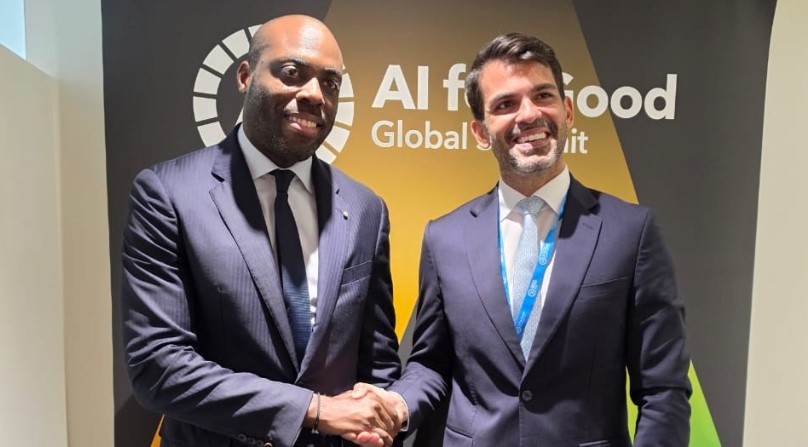 Gabon's digital economy minister Mark-Alexandre Doumba shaking hands with TikTok's regional director Emir Gelen