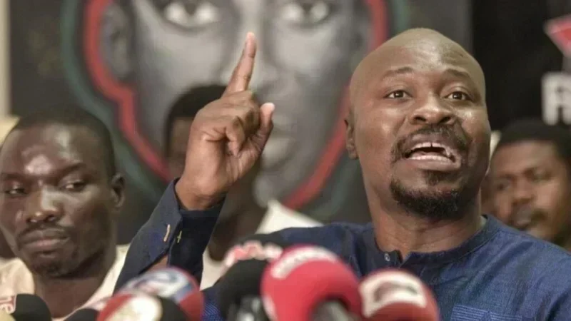 Portrait of Guy Marius Sagna discussing political funds in Senegal