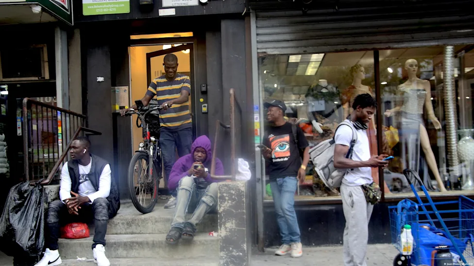 Migrants gathered outside a court building in Yaoundé