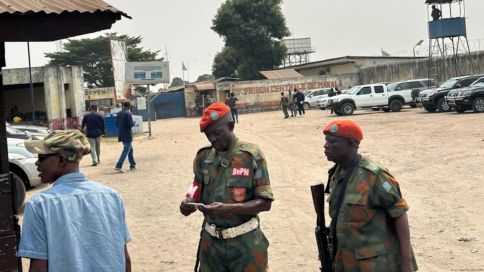 Congolese officials reviewing prisoner records at CNSA headquarters