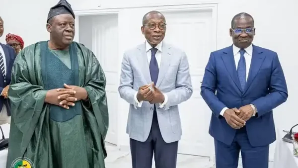 Benin Senate office meeting room with officials in discussion
