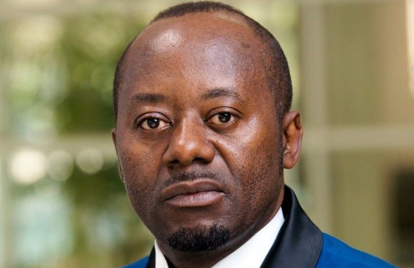 Alain-Georges Moukoko, Gabon's newly appointed prosecutor general, seated at a desk with legal documents